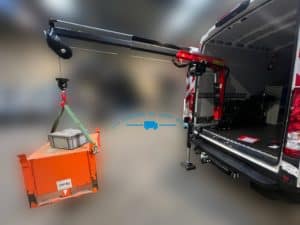 Véhicule atelier mobile avec une grue en action